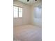 Well-lit bedroom featuring neutral carpet and a window, offering a serene space at 3648 E Perkinsvile St, Gilbert, AZ 85295