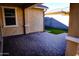 Covered patio with brick pavers and stucco walls, creating a cozy outdoor space at 3648 E Perkinsvile St, Gilbert, AZ 85295