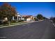 Street view of well-maintained homes with colorful trees lining the street at 3648 E Perkinsvile St, Gilbert, AZ 85295