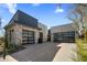 Modern home with black framed garage door and concrete brick facade, with desert landscaping at 37200 N Cave Creek Rd # 1072, Scottsdale, AZ 85262