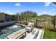 Relaxing pool area with mountain views, featuring a waterfall feature, comfortable seating, and desert landscaping at 37200 N Cave Creek Rd # 1072, Scottsdale, AZ 85262