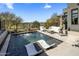 Beautiful pool area with lounge chairs, a mountain view, and desert landscaping for ultimate relaxation at 37200 N Cave Creek Rd # 1072, Scottsdale, AZ 85262