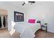 Bright bedroom with modern decor, white bedding, and a view of the closet at 378 W Satinka Dr, San Tan Valley, AZ 85140