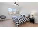 Bright bedroom with a polka dot comforter, a ceiling fan, and natural light from a window at 378 W Satinka Dr, San Tan Valley, AZ 85140