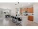 Spacious kitchen island with barstools is perfect for casual dining and meal preparation at 378 W Satinka Dr, San Tan Valley, AZ 85140