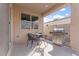 Outdoor patio with a stainless steel grill, table, and chairs at 378 W Satinka Dr, San Tan Valley, AZ 85140