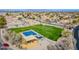 A beautiful community park featuring a playground, basketball court, and open green space for recreation and enjoyment at 39935 N Passaro Dr, San Tan Valley, AZ 85140