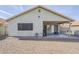 Cozy backyard featuring a gravel area and covered patio, perfect for outdoor entertaining and relaxation at 39935 N Passaro Dr, San Tan Valley, AZ 85140