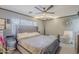 Cozy bedroom featuring a plush bed, neutral tones, and a well-lit interior at 39935 N Passaro Dr, San Tan Valley, AZ 85140