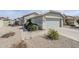 Charming single-story home with a well-maintained yard and attached two-car garage at 39935 N Passaro Dr, San Tan Valley, AZ 85140