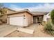 Charming single-story home with a two-car garage and well-maintained front yard at 40656 N Key Ln, Anthem, AZ 85086