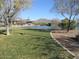 Picturesque community pond with bridge, ducks, gazebo and lush landscaping at 40656 N Key Ln, Anthem, AZ 85086