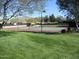 View of the community tennis court with well manicured landscaping and mountain views at 40656 N Key Ln, Anthem, AZ 85086