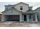 Under construction two-story home showing stucco and siding with a two car garage and porch at 4185 E Kolin Ln, San Tan Valley, AZ 85143