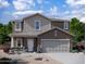 Charming two-story home features a two car garage, desert landscaping and a covered porch entry at 4185 E Kolin Ln, San Tan Valley, AZ 85143