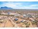 Aerial image showcasing the serene desert home, horse property, mountain vistas and vibrant Arizona skies at 4188 N Plaza Dr, Apache Junction, AZ 85120