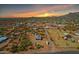 Expansive aerial view showcasing the desert community at sunset, highlighting its scenic location at 4188 N Plaza Dr, Apache Junction, AZ 85120