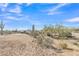 Spacious horse property featuring metal pipe fencing and plenty of room under the bright Arizona sun at 4188 N Plaza Dr, Apache Junction, AZ 85120