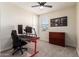 Bedroom area with a ceiling fan, a desk, a rolling chair, and a window at 4459 E Warlander Ln, San Tan Valley, AZ 85140