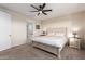 Comfortable bedroom featuring soft carpet, neutral walls, and an ensuite bathroom with a glass shower at 4459 E Warlander Ln, San Tan Valley, AZ 85140