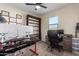 A bedroom featuring an office space, a ceiling fan, and a rolling chair at 4459 E Warlander Ln, San Tan Valley, AZ 85140