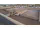 Exterior aerial of home showing the tidy front yard, well-maintained gravel landscaping, and private fenced-in backyard at 4459 E Warlander Ln, San Tan Valley, AZ 85140