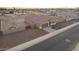 Aerial view of home displaying the landscaped front yard, a driveway, and a view of the neighborhood at 4459 E Warlander Ln, San Tan Valley, AZ 85140