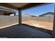 Backyard with cinder block wall under covered patio at 46886 W Old Timer Rd, Maricopa, AZ 85139