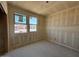 This bedroom shows the installation of drywall and two windows providing natural light at 46886 W Old Timer Rd, Maricopa, AZ 85139
