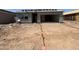 Under construction exterior showing a single story home with garage and desert landscaping at 46886 W Old Timer Rd, Maricopa, AZ 85139