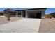 Charming single-story home showcasing a spacious driveway and low-maintenance desert landscape at 46886 W Old Timer Rd, Maricopa, AZ 85139