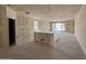 Spacious living room with large windows and sliding glass doors that lead to the outside at 46886 W Old Timer Rd, Maricopa, AZ 85139
