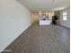 Bright and open floor plan featuring a kitchen with modern appliances and a spacious living area at 46886 W Old Timer Rd, Maricopa, AZ 85139