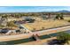 Gorgeous aerial view of the neighborhood park including grassy playfields, covered playgrounds, and convenient parking at 475 S Soho Ln # 35, Chandler, AZ 85225