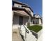 Inviting front porch featuring stone-accented columns and manicured artificial turf, creating a welcoming entrance at 475 S Soho Ln # 35, Chandler, AZ 85225