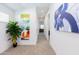 Bright hallway featuring neutral carpet, modern art, and white walls offering a clean, contemporary aesthetic at 475 S Soho Ln # 35, Chandler, AZ 85225