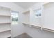 Well-organized walk-in closet with shelving, and natural light, ready for easy storage at 475 S Soho Ln # 35, Chandler, AZ 85225