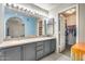 Bathroom featuring a large double vanity and walk-in closet with ample storage solutions at 5915 E Fairfield St, Mesa, AZ 85205