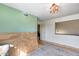 Upstairs bedroom with neutral paint, and a large window with natural light at 5915 E Fairfield St, Mesa, AZ 85205