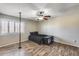 Comfortable bedroom featuring natural light, a ceiling fan and modern flooring for a cozy feel at 5915 E Fairfield St, Mesa, AZ 85205