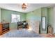 Upstairs bedroom with neutral paint, and a large window with natural light at 5915 E Fairfield St, Mesa, AZ 85205