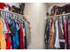 Walk-in closet with plenty of shelving for clothes and shoe storage at 5915 E Fairfield St, Mesa, AZ 85205