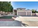 Charming two-story home with a three-car garage and desert landscaping at 5915 E Fairfield St, Mesa, AZ 85205