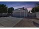 Spacious three-car garage with ample parking and a basketball hoop for recreation at 5915 E Fairfield St, Mesa, AZ 85205