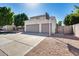 Three-car garage with basketball hoop and spacious driveway at 5915 E Fairfield St, Mesa, AZ 85205