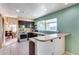 Bright and airy kitchen with a view of the dining area and backyard, great for entertaining at 5915 E Fairfield St, Mesa, AZ 85205