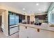 Bright kitchen with dark wood cabinets, appliances, and large window over looking the counter at 5915 E Fairfield St, Mesa, AZ 85205