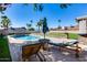 Resort-style pool area with a pool, lounge chairs, and lush landscaping offering a perfect outdoor oasis at 5915 E Fairfield St, Mesa, AZ 85205