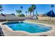 Inviting pool with cool blue water offers a refreshing escape in a private backyard setting surrounded by lush landscaping at 5915 E Fairfield St, Mesa, AZ 85205