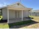 Covered back patio with sliding glass door and secure metal door, concrete foundation, and view of the backyard at 614 W 7Th Ave, Mesa, AZ 85210